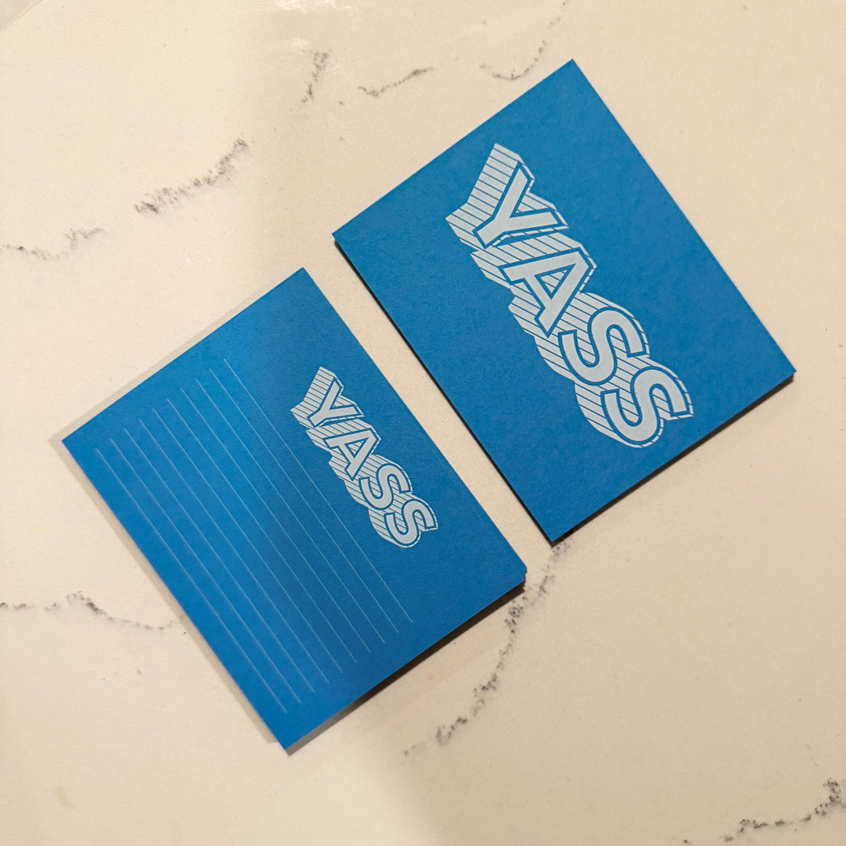 Blue Yass notecard set with bold graphic text and matching lined stationery for personalized messages. - Yass Notecard Set