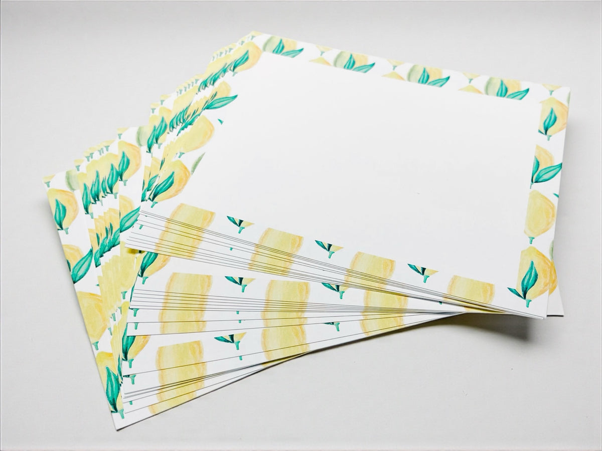 Stack of personalized stationery lemon notecards with yellow lemon border and green leaves. - Lemon Notecard Set