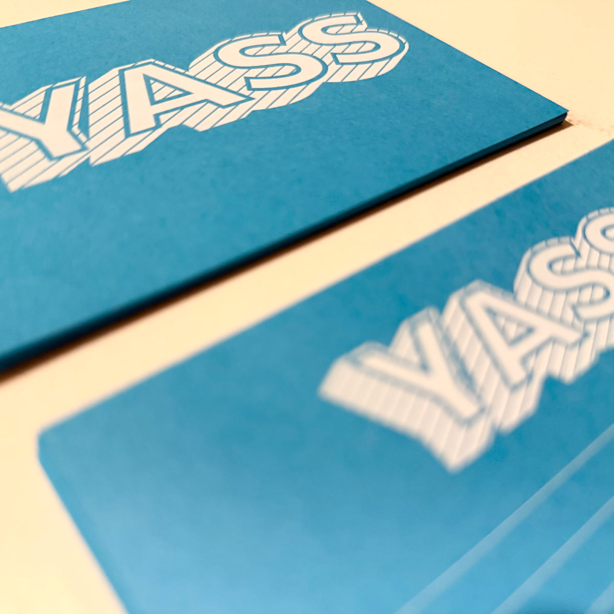 Blue stationery notecards with bold white "YASS" lettering for custom, personalized messages. - Yass Notecard Set