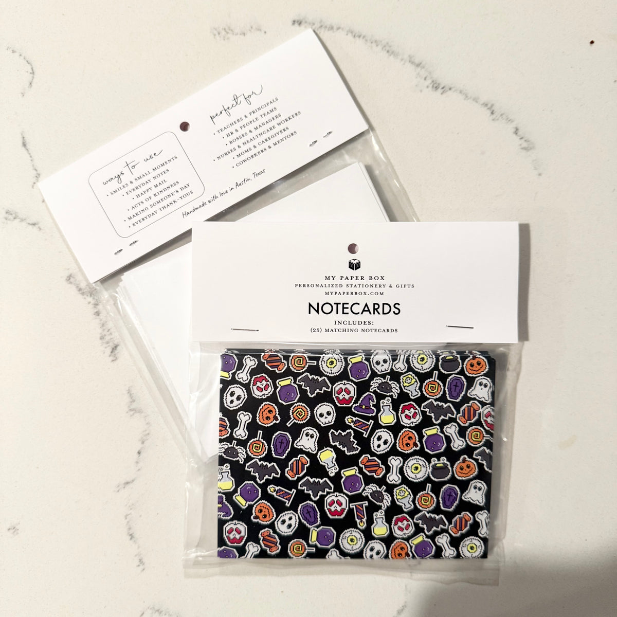 Custom Halloween-themed notecard set with pixel art icons on black stationery background. - Halloween Pixels Notecard Set