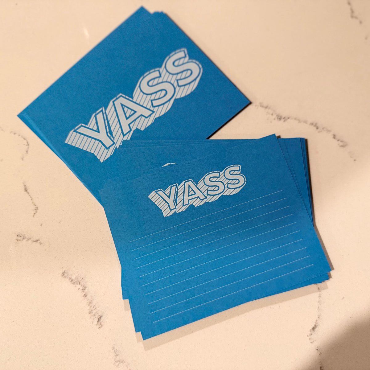 Blue stationery notecard set with bold white YASS text and lined personalized writing space. - Yass Notecard Set