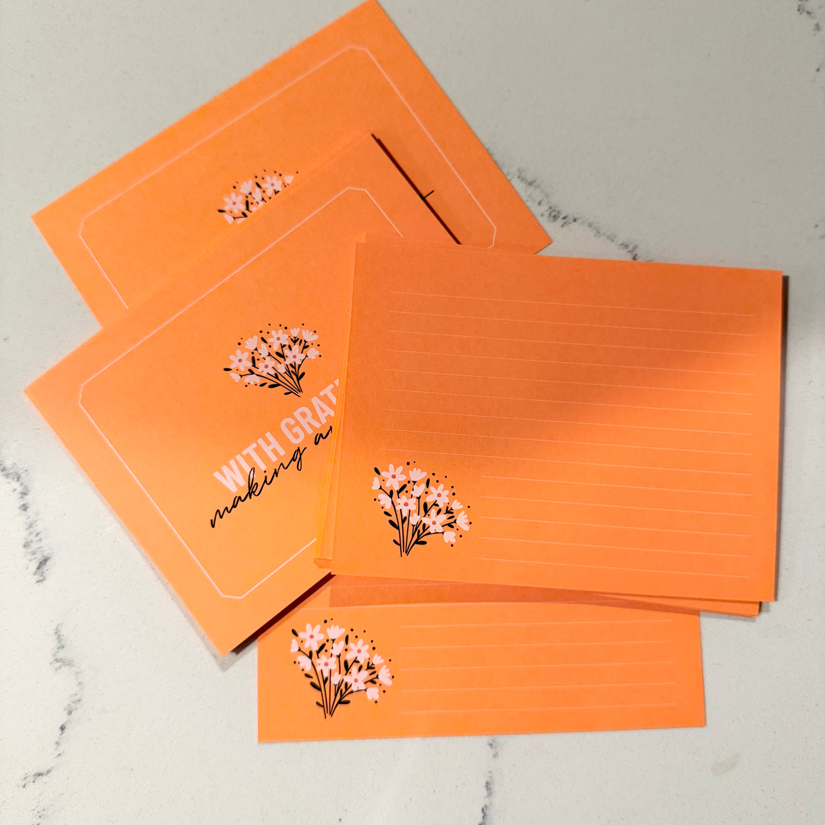 Custom orange stationery set with floral accents and personalized "With Gratitude" notecards. - With Gratitude Notecard Set