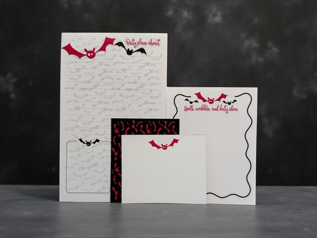 Personalized stationery set with bat design, includes custom notepad, notecards, and envelopes with red and black accents. - Batty Ideas Notepad and Notecard set