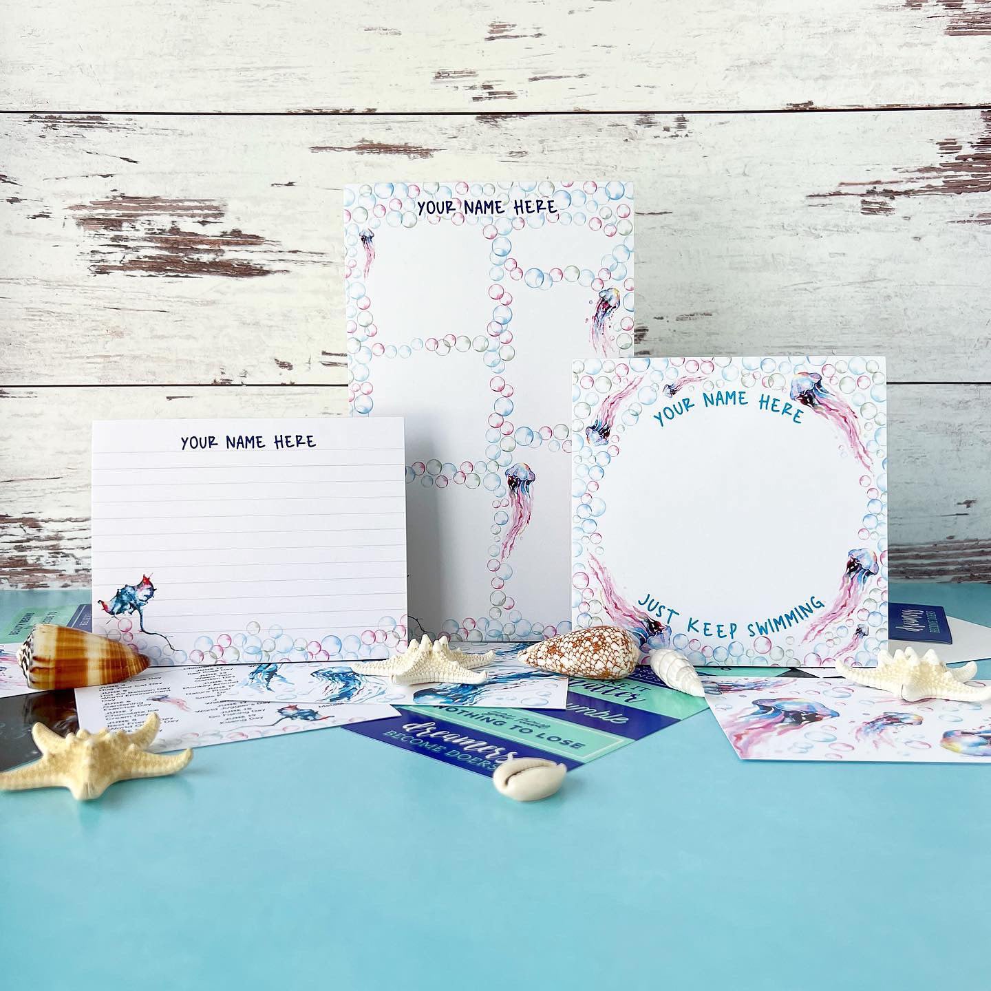 Stationery set with personalized stationery items on a wooden surface