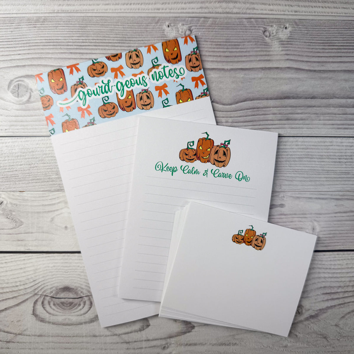 Personalized stationery set with custom pumpkin-themed notepad, notecards, and matching envelope on wood surface. - Gourd-geous Notepad and Notecard set