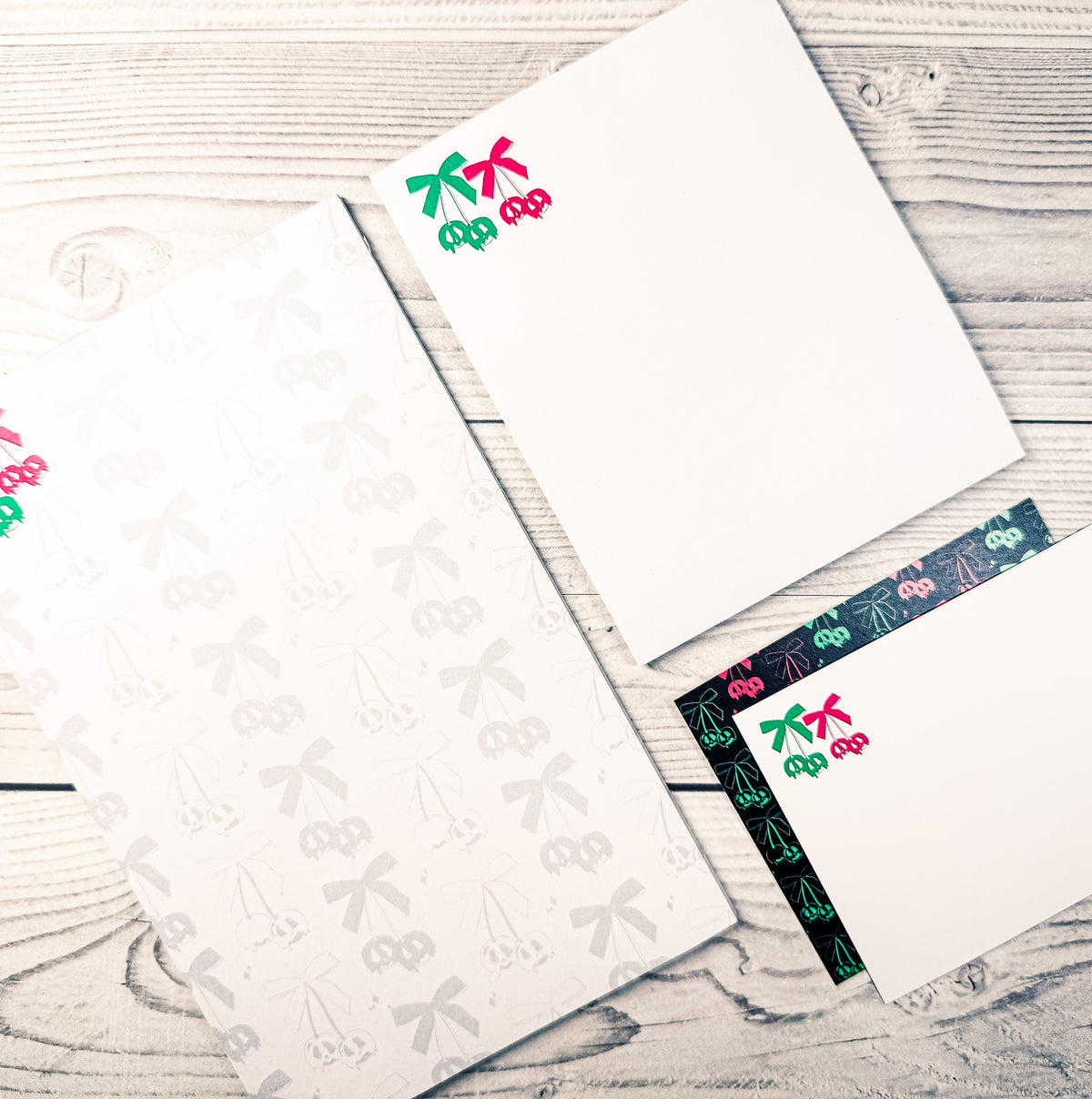 Custom personalized stationery set featuring notepad and notecards with playful cherry design and dark patterned trim. - Scary Cherries Notepad and Notecard set