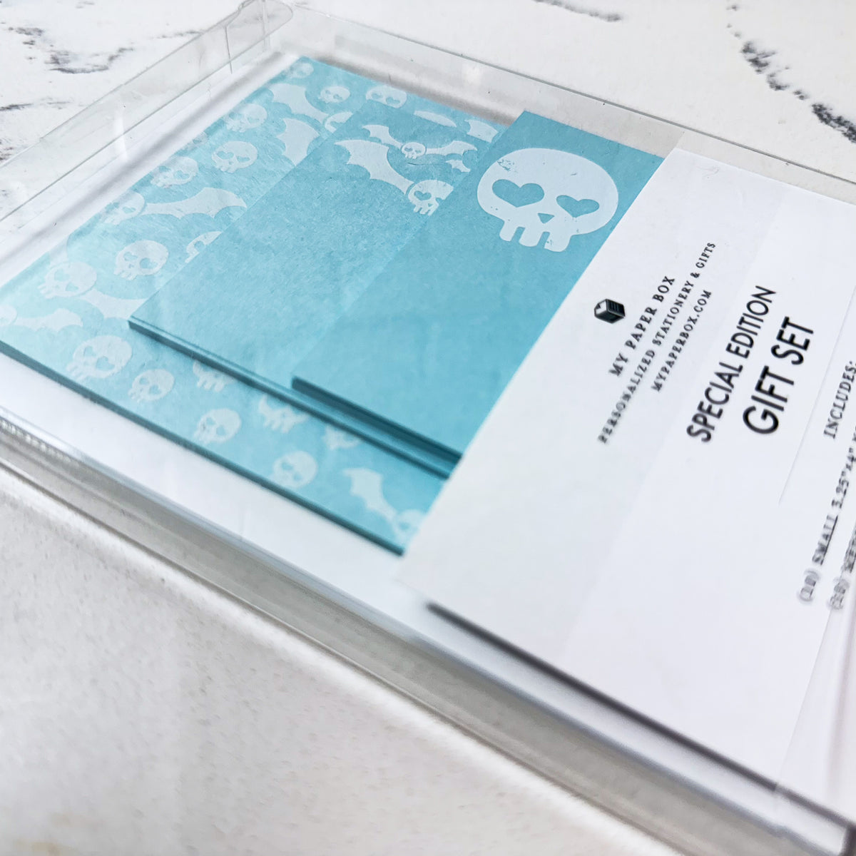 Blue skull-themed stationery gift set with custom notecards and personalized notepad. - Special Edition Skull Stationery Gift Set | Cute Goth Notecards & Notepad