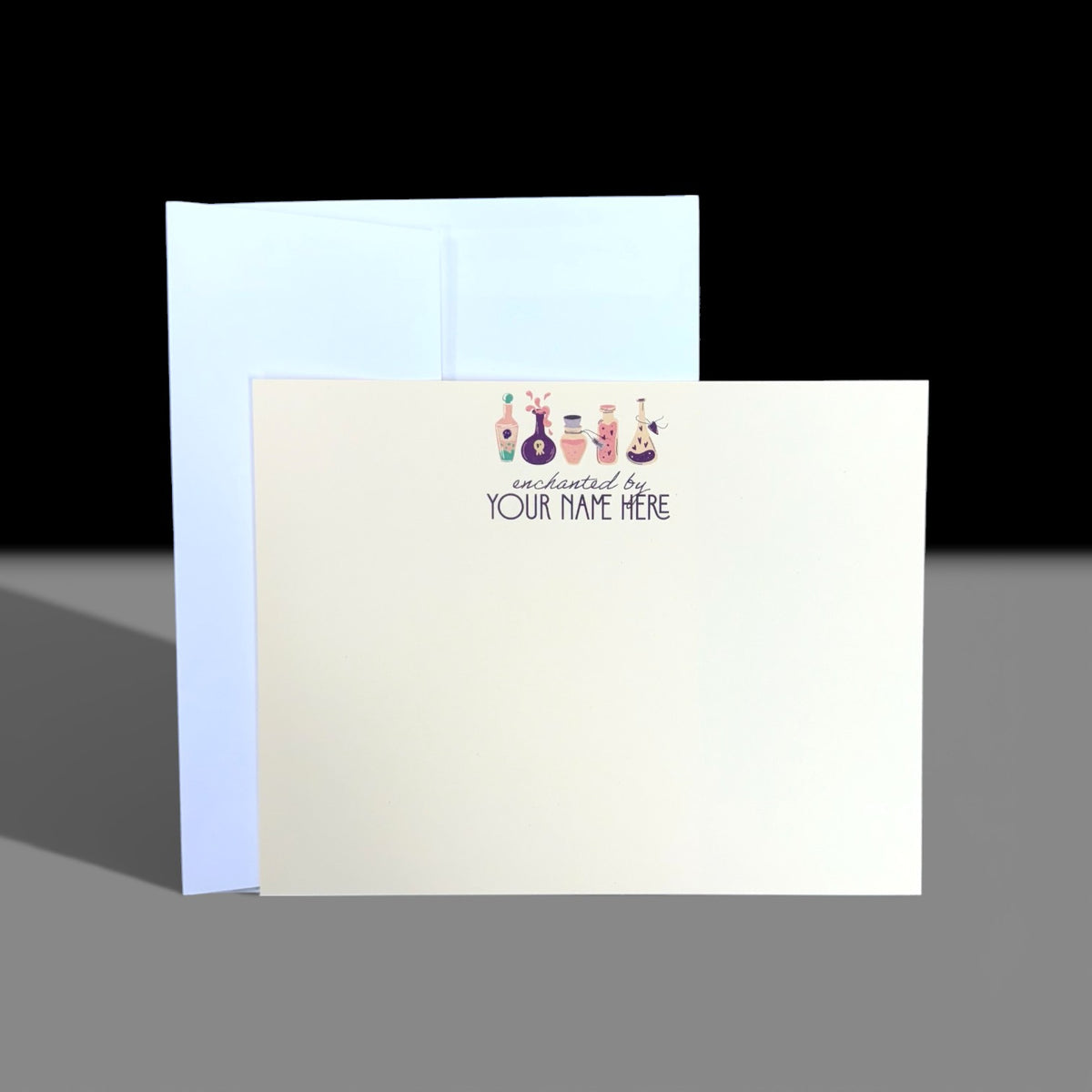 Tan flat A2 notecard with colorful witchy potion bottles and customizable "Your Name Here" text at top center, white.