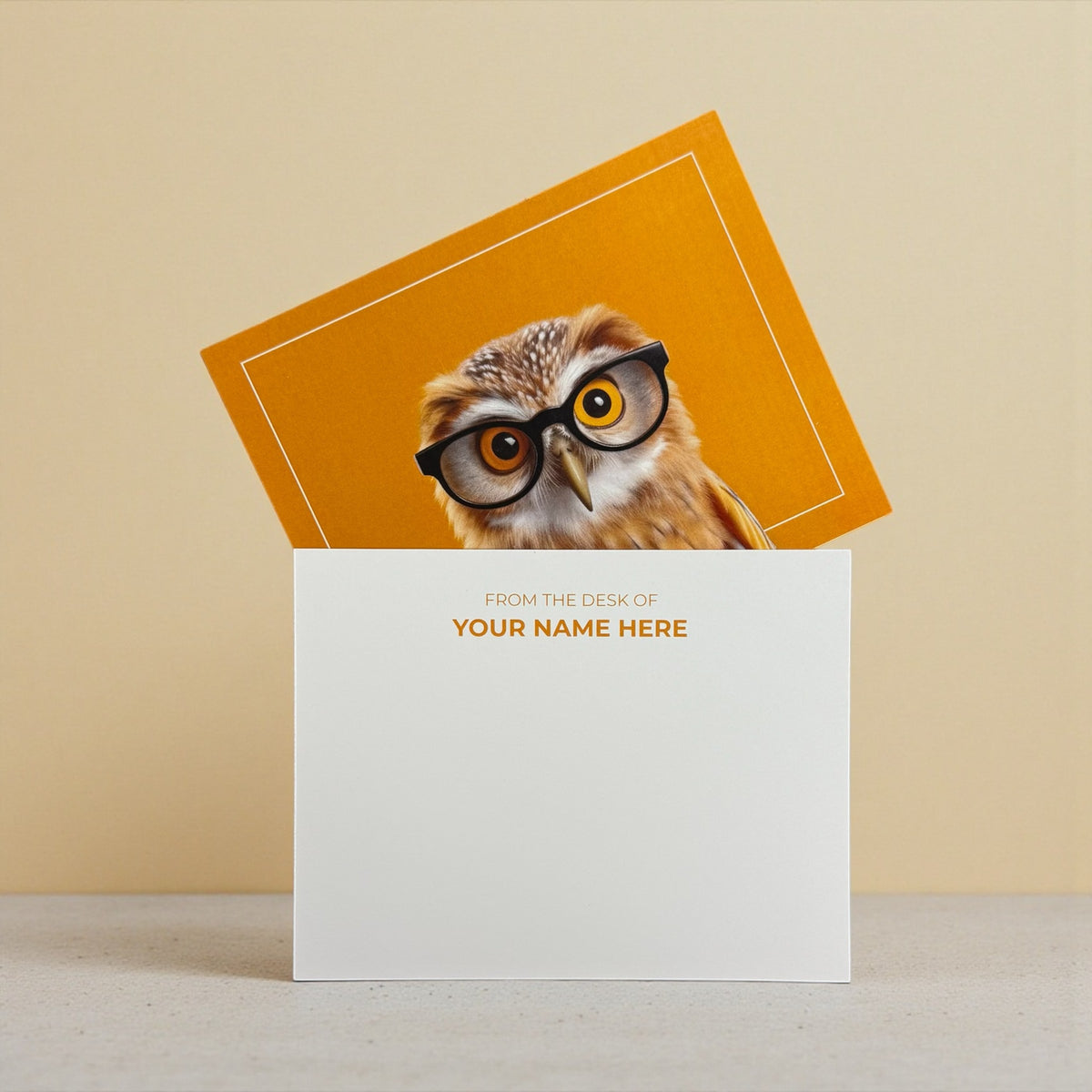 White A2-sized note card with personalized text above an illustrated owl wearing black glasses on an orange background insert.