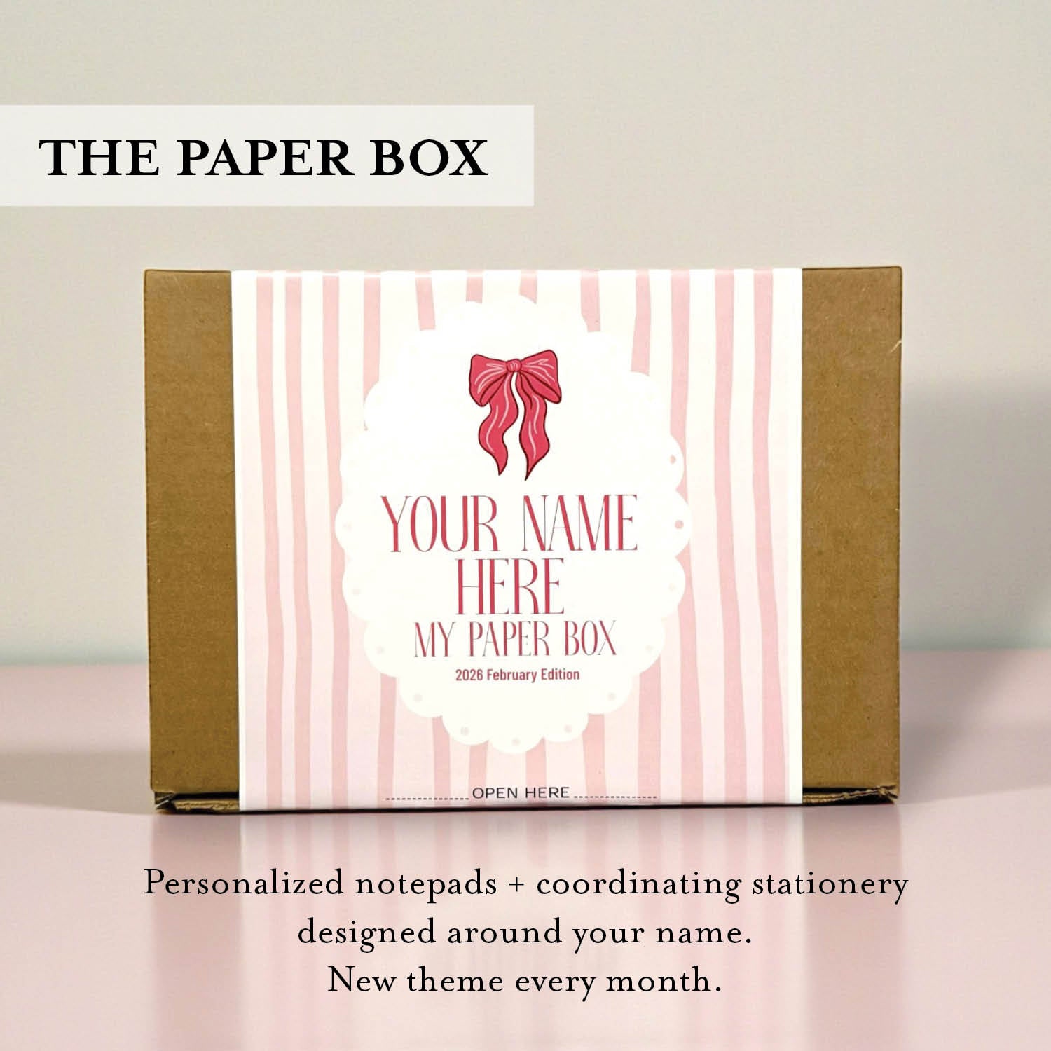 Personalized stationery box with pink bow design and text on a light background